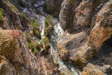 River Durance near its source at the bottom of a narrow gorge above Briançon in the French Alps in...