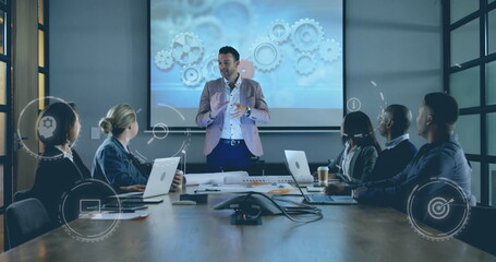 Image of icons over diverse business people