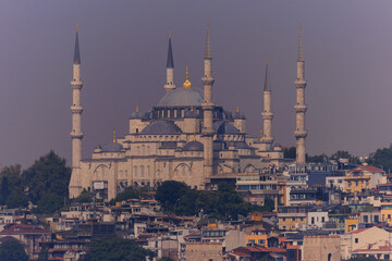 Evening view of the city, Sunset sky. Old Mosques with minarets. Public place in Istanbul, Turkey. 