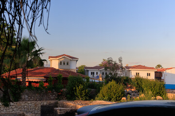 Southern cityscape, view of buildings and houses in public places in Turkey, sunny summer day in a resort town