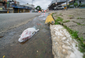 Water and garbage on the main street of this large city in the State of São Paulo - Brazil