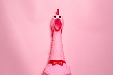 close up of a pink chicken toy