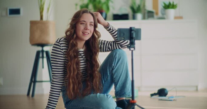 Beautiful female content creator filming herself talking