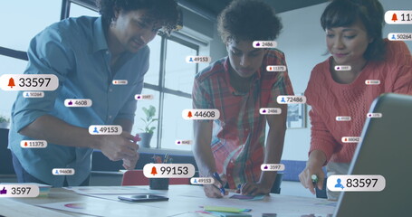 Image of numbers, icons in notification bars, diverse coworkers working on product design