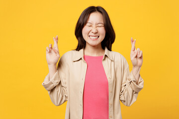 Young woman of Asian ethnicity wear pink t-shirt beige shirt casual clothes wait special moment,...