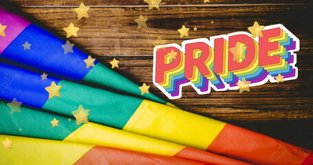 Image of stars over rainbow flag and pride text