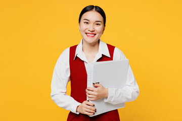 Young corporate lawyer employee business woman of Asian ethnicity wears red vest shirt work at...