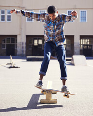Man, skateboard and balance with riding at skatepark, sport and energy with skill, stunt and...