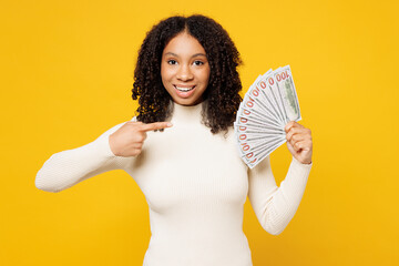 Little kid teen girl of African American ethnicity wear white casual clothes hold fan of cash money...