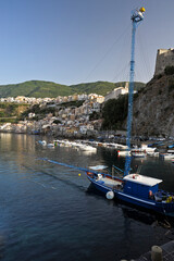 Chianalea di Scilla, Reggio Calabria district, Calabria, Italy, in the foreground gangway or felucca used for swordfish fishing - obrazy, fototapety, plakaty