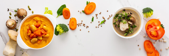 Mushroom and lentil cream soup, beans, carrot and tomato soup, broccoli and spinach soup on white...