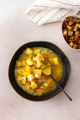 Pea soup with fried croutons, healthy bean soup, top view
