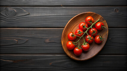 Cherry Tomatoes on Vine on a Dark Plate and Wooden Background
