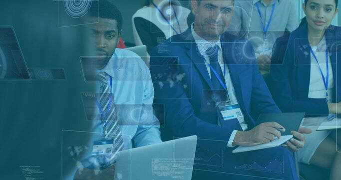 Image of processing circles on digital screens over diverse businesspeople during meeting
