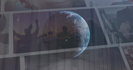 Image of globe rotating over data on screens