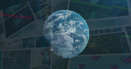 Image of globe rotating over data on screens