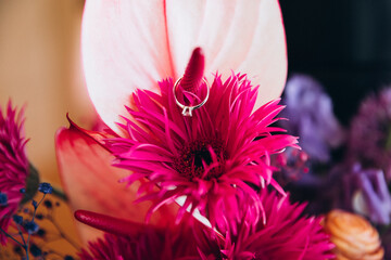 Wedding. Bride's bouquet of bright and colored flowers and engagement ring