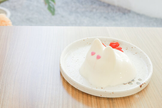 Rabbit pudding on plate in cafe,Bunny Jelly popular dessert in japan or korea,Japanese desserts,valentines day.