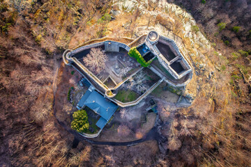 Aerial view of Medieval Castle Chojnik. Castle raised in XIII century on the top of the hill with beautiful panorama. Lower Silesia, Poland