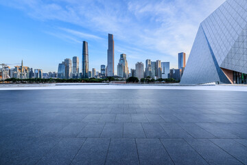 Empty square floors and city skyline with modern buildings at sunrise in Guangzhou