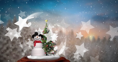Image of snow and stars over snow globe with christmas tree and snowman