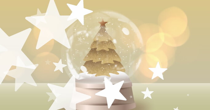 Image of light spots and stars over snow globe with christmas tree