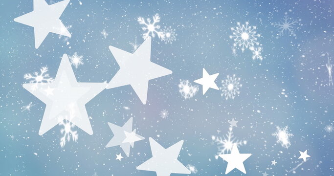 Image of snow and stars over blue background