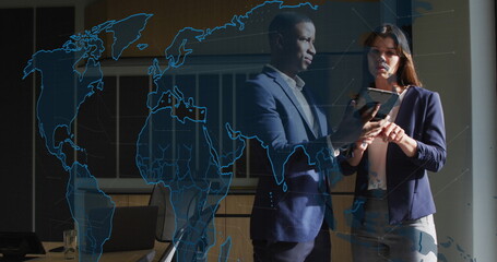 Image of world map and data processing over business people using tablet