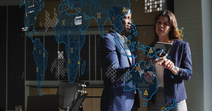 Image of world map and data processing over business people using tablet