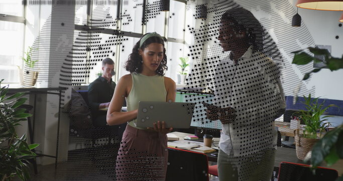 Image of world map and data processing over business people using laptop