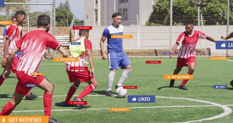 Fototapeta premium Image of social media icons over diverse male soccer players playing soccer on sports field