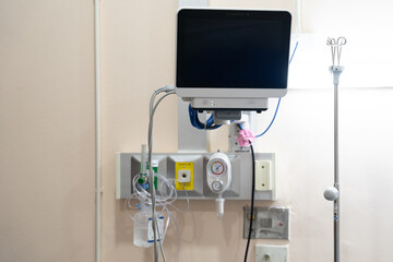 lood pressure, oxygen and EKG/EKC monitor screen in a patient room in a hospital