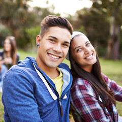 Obraz premium Couple, portrait and smile in nature for adventure, picnic date and weekend break in outdoor park. Face, happy man and woman in sunshine for bonding, relaxing holiday and travel in countryside