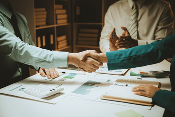 Business team analyzing income charts and graphs with modern laptop computer. Close up.Business analysis and strategy concept.