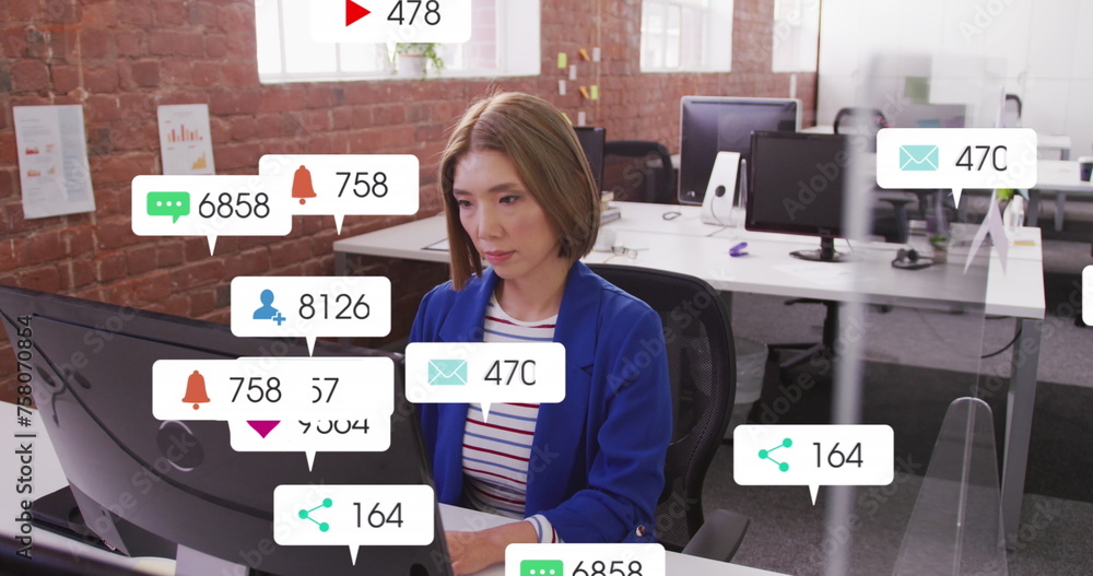 Poster image of multiple notification bars over asian woman working on computer in office
