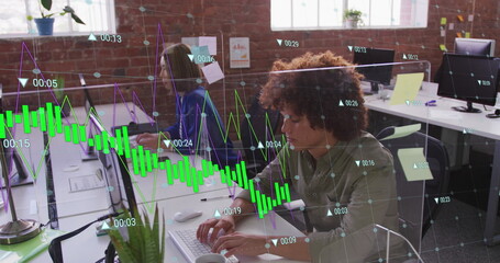 Image of multiple graphs with changing numbers over biracial man working on computer in office
