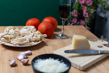 Selective focus on some noodles among other dinner ingredients.