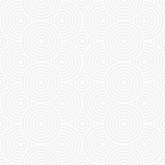 Fototapeta na wymiar Seamless trendy pattern of circles and arcs, geometric white shapes for textiles and wallpaper. Festive Christmas pattern on a gray background.