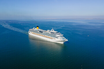 Cruise liner ship sailing across Mediterranean sea. Aerial view