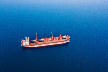 Ship cargo holds cleaning operation by means of high pressure water, Aerial wide shot