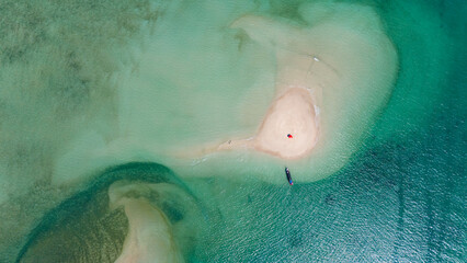 Aerial view of Koh Pah, unseen island in Khao Lak, Thailand, that is often called Thai Maldives. Private picnic on the uninhabited island for a couple. 