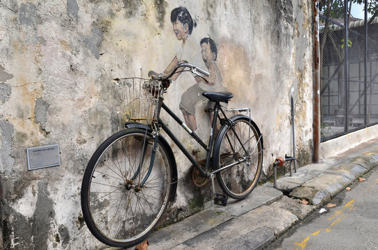 Little Children on a Bicycle street art mural by Lithuanian artist Ernest Zacharevic
