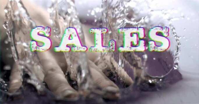 Animation of sales text over hand splashing water