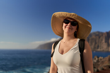 Young happy woman in Tenerife on the shore