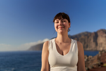 Fototapeta na wymiar Beautiful woman on the shores of Tenerife
