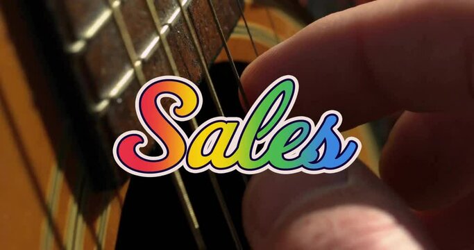 Animation of sales text over hand playing guitar