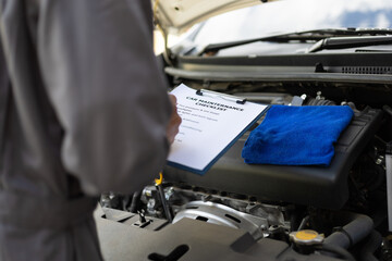 Services car engine machine, Automobile mechanic repairman checking a car engine with inspecting...