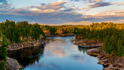 Saguenay, Canada - August 14 2019: Saguenay river Golden Sunset view near Saguenay City