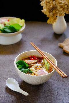 laksa ikan, asam laksa, rice noodle,vegetables, filet fish with sour soup, popular in penang, malaysia