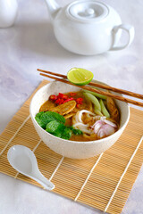 laksa ikan, asam laksa, rice noodle,vegetables, filet fish with sour soup, popular in penang,...